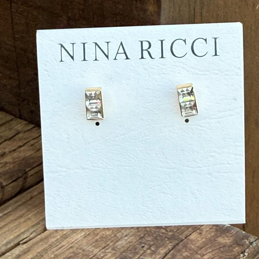 NWT Nina Ricci gold-plated studs featuring channel-set Swarovski crystals